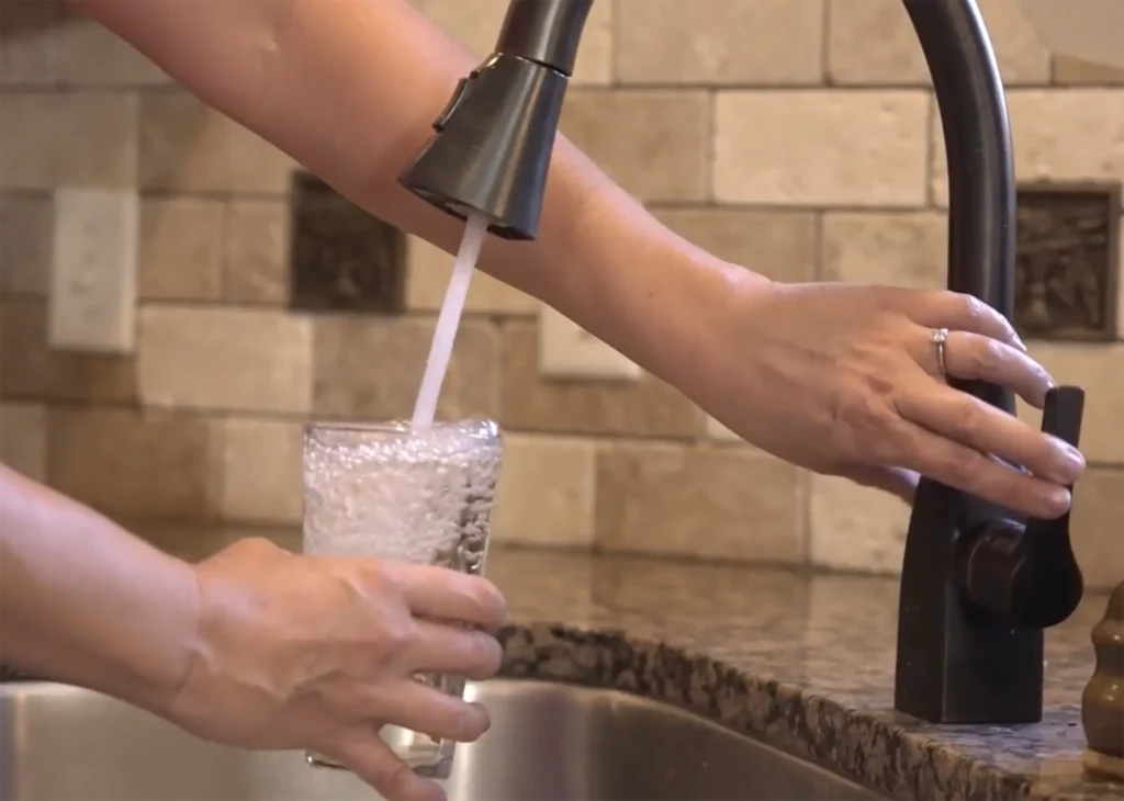 clean water filling up glass-lorenz plumbing heating and air-springfield