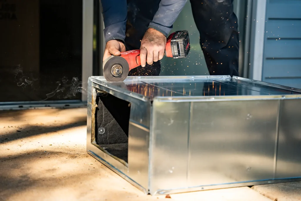 team member sawing product-lorenz plumbing heating and air-springfield