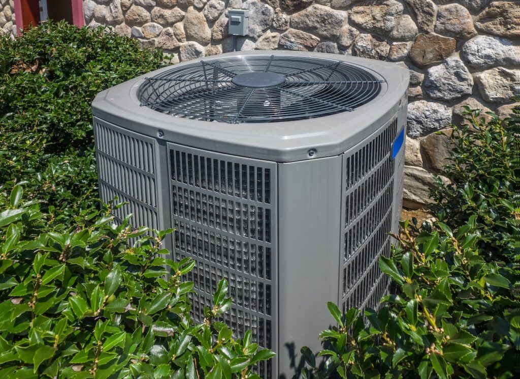 Air conditioning and heating unit for a residential house