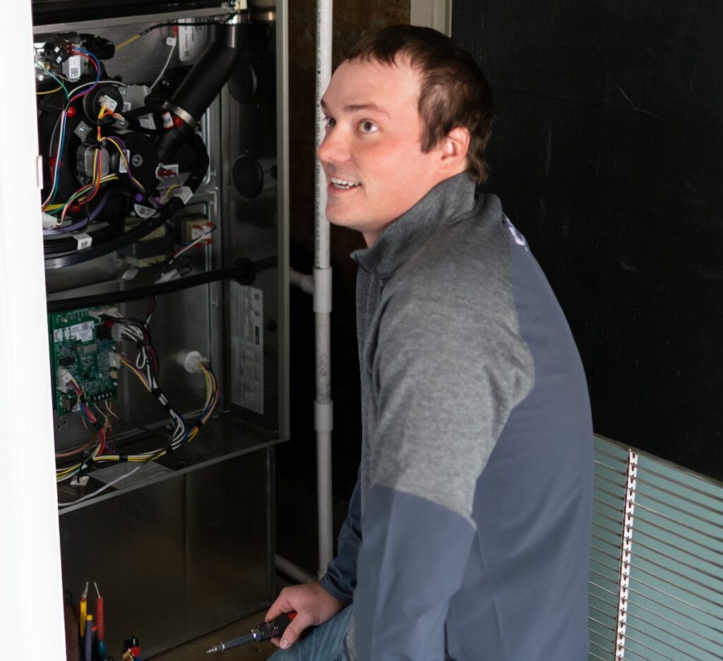 Lorenz team member working on furnace