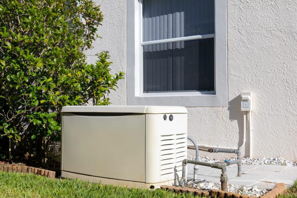 Home electric power generator on the side of house for use of emergency power outage