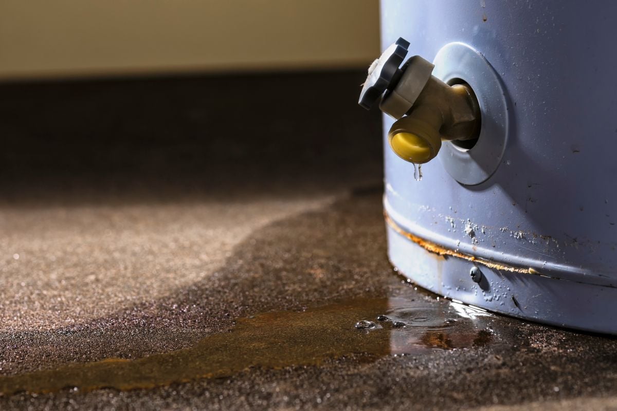 Water Heater leaking small drops of water floor is wet