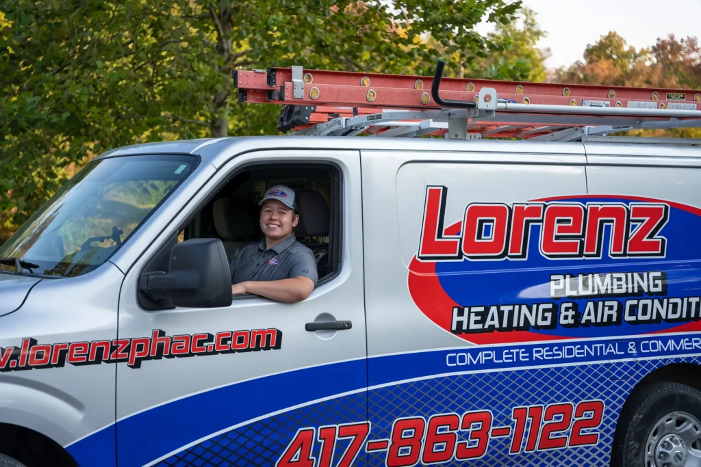 AC repair smiling team member in van Lorenz Plumbing heating and air-springfield