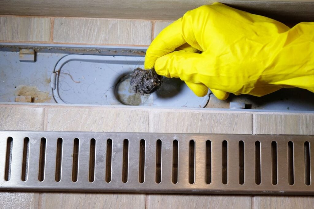 how to unclog a shower drain cleaning yellow glove removing mold and old hair