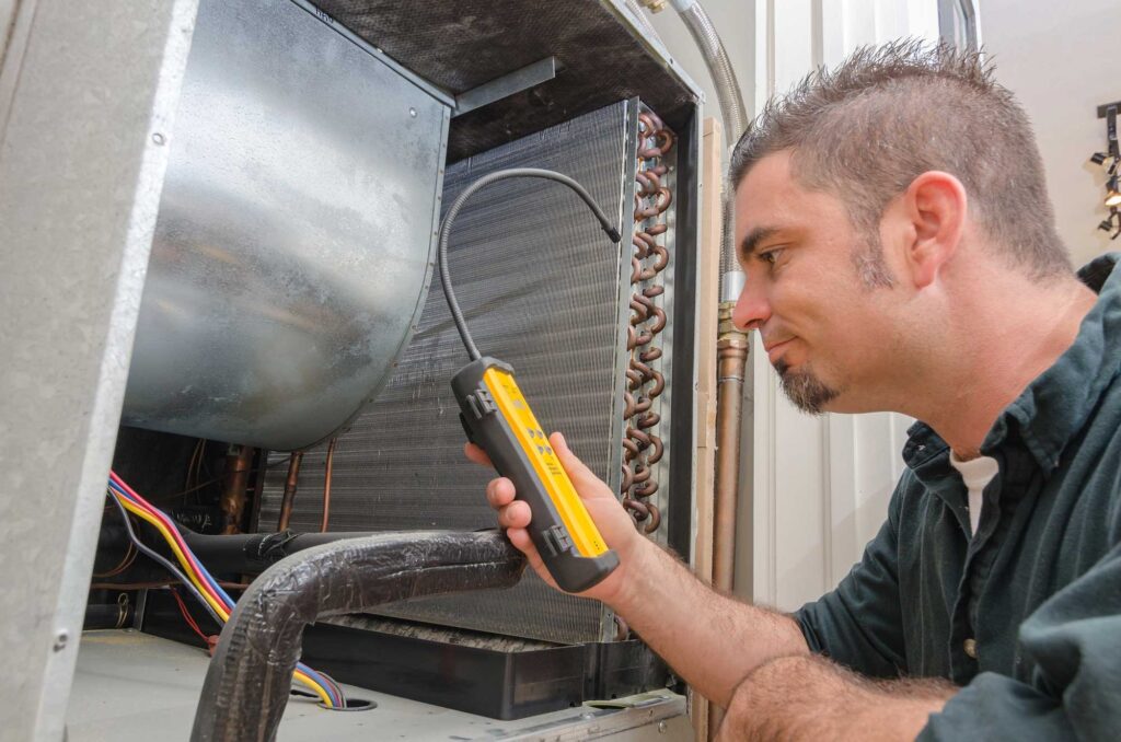 HVAC-Technician-with-Leak-Detector