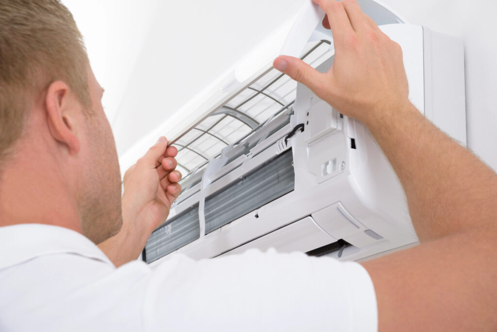 Man-Adjusting-Air-Conditioning-System
