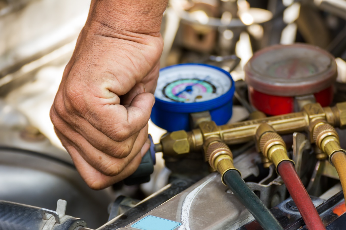 closeup-of-hand-making-ac-repairs