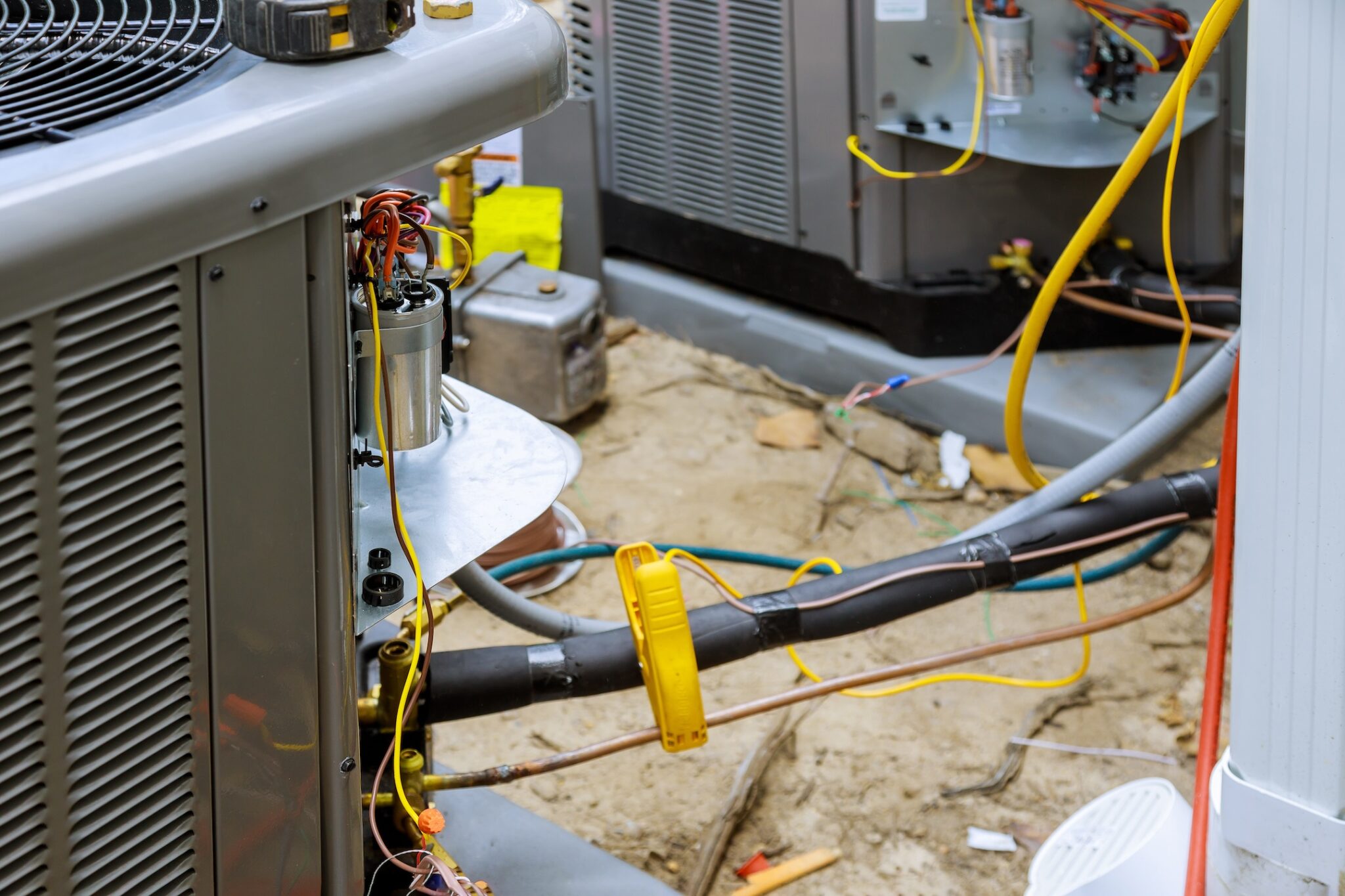 closeup-of-wires-leading-to-ac-unit-being-repaired