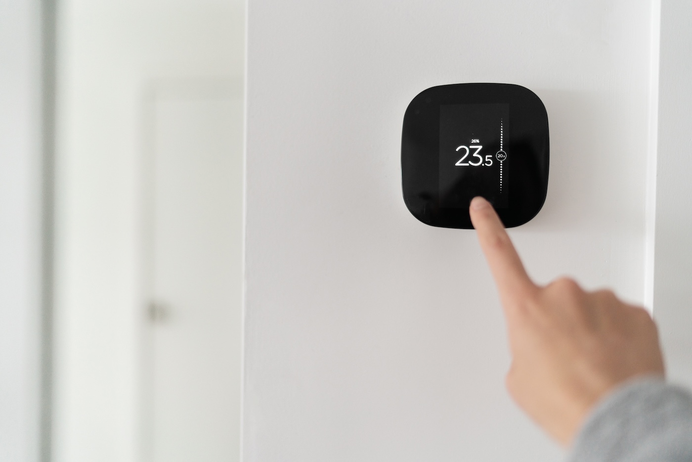 person-using-smart-thermostat-lorenz