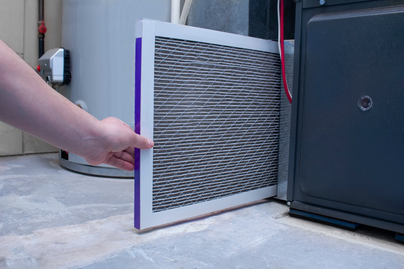 technician-changing-filter-on-new-furance-replacement