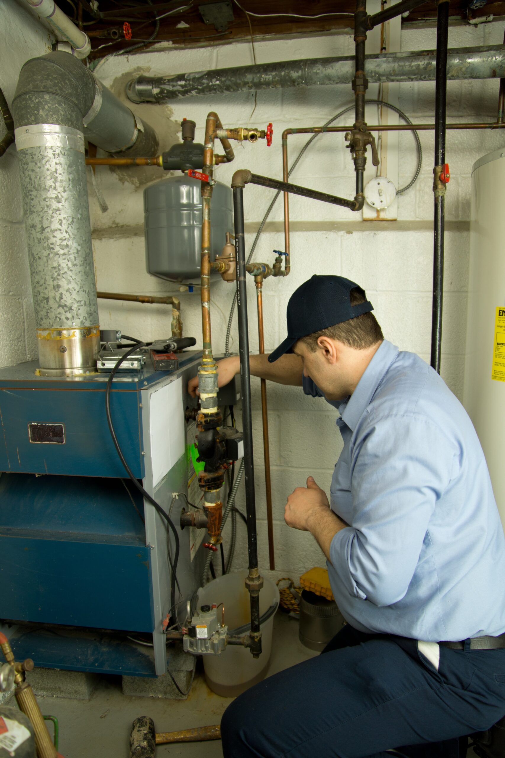 Plumber repairs furnace
