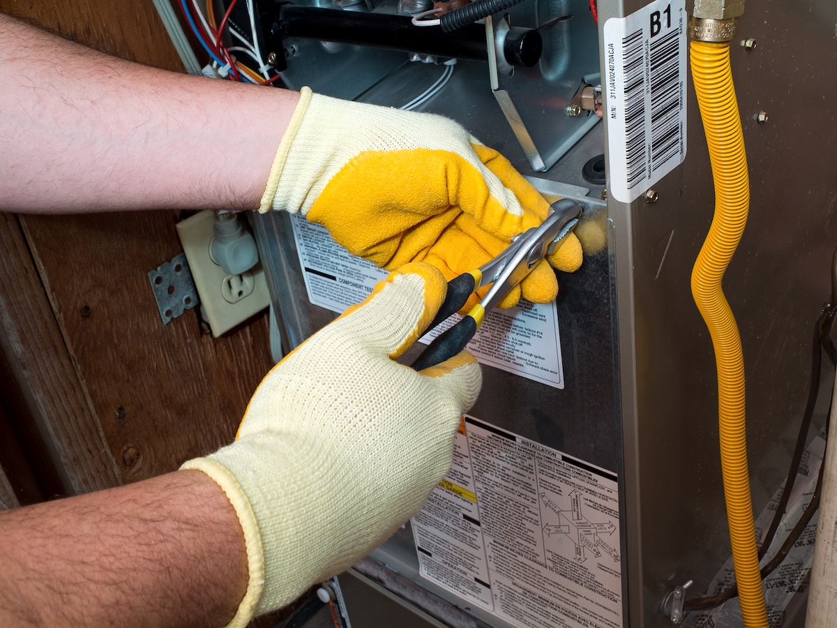 using-pliers-for-furnace-repair